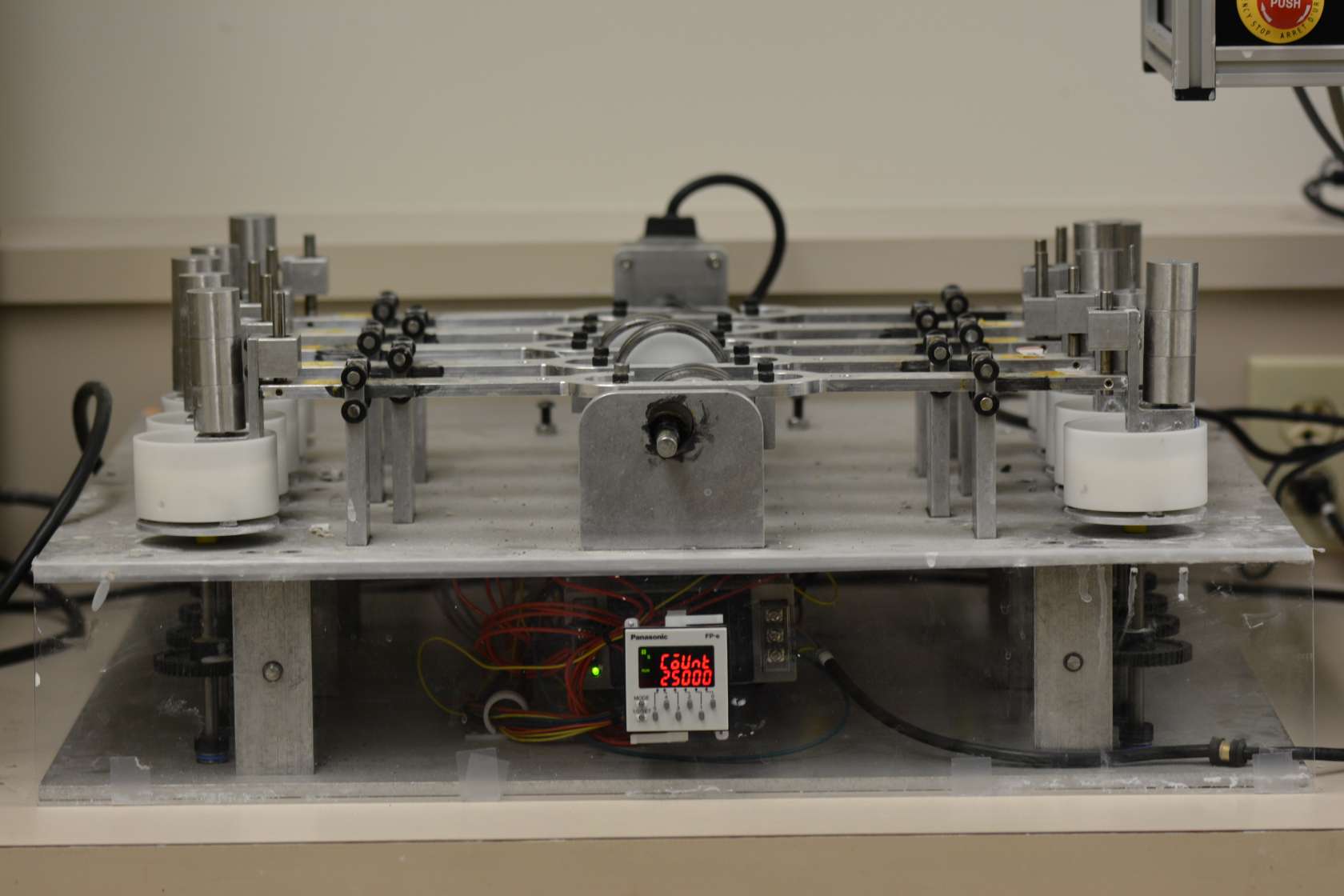 The device simulates various brushing movements on the surfaces of teeth and material specimen. A maximum of 10 specimens are simultaneously exposed to abrasion in the tooth brushing machine. Each specimen may be different in form and material (hardness), and may be loaded with various levels of contact pressure. The specimen chambers are separated from each other so that each specimen can be operated with its own liquid (e.g. toothpaste-water mix), and individually cleaned. All the brushes are controlled by a central drive system, and the chosen type of movement is therefore the same for all specimens used in the test. A high-grade motion controller guarantees exact speeds and trajectories which can be adjusted with a very high degree of precision. The motion sequence (teeth cleaning technique) can be freely selected from a combination of forwards, backwards and circular movements. Complex motion sequences can be easily programmed by means of an optional software module.